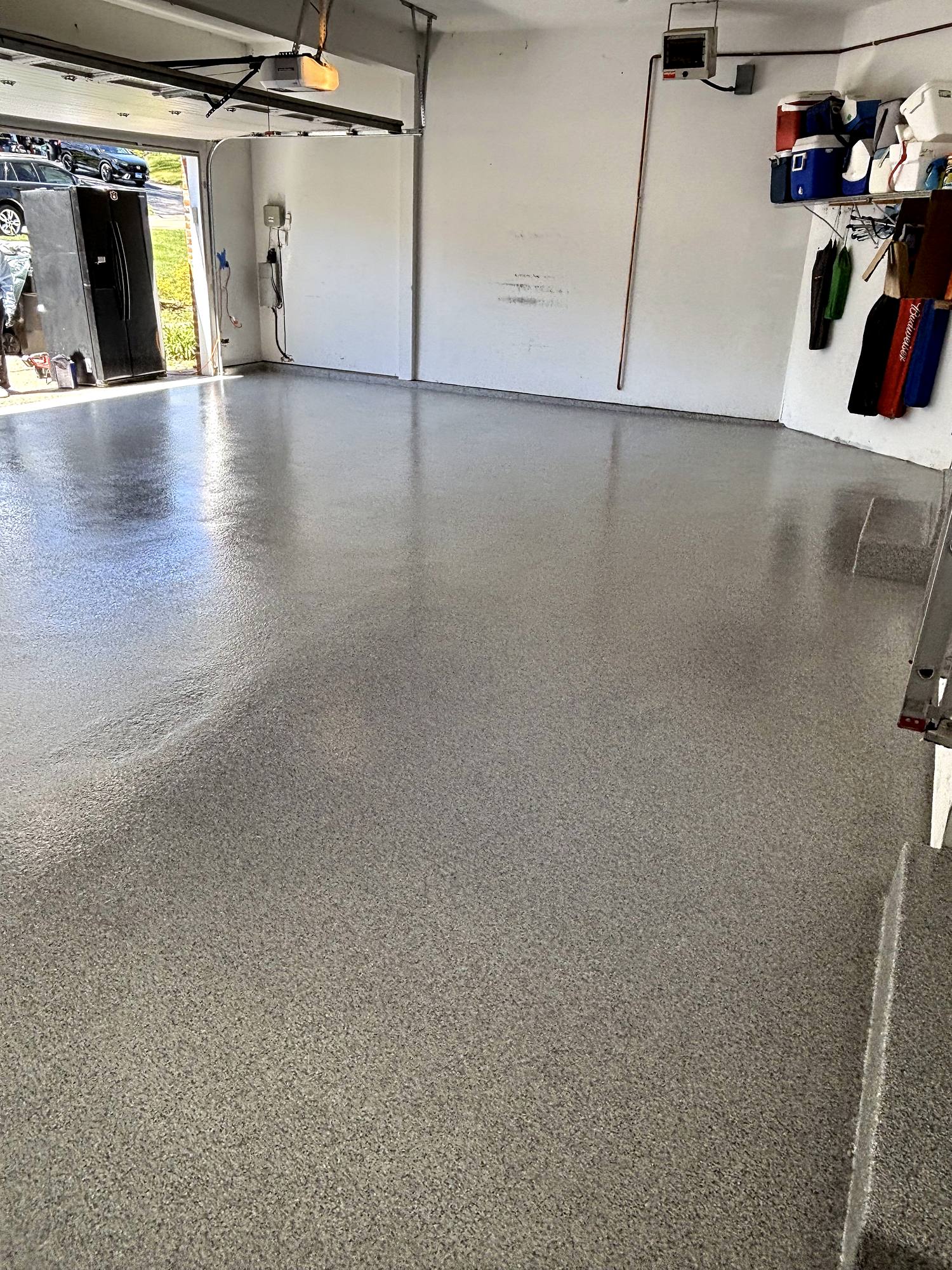 Finished flake epoxy garage floor after crack repair